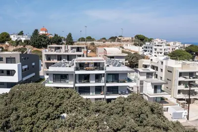 an aerial view of a city with white buildings at Rodos Nest with terrace and seaview in Asgourou