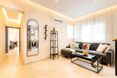 a living room with a couch and a table at Acropolis Gem in Rhodes Town