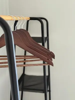 a wooden chair sitting next to a table at Acropolis Gem in Rhodes Town