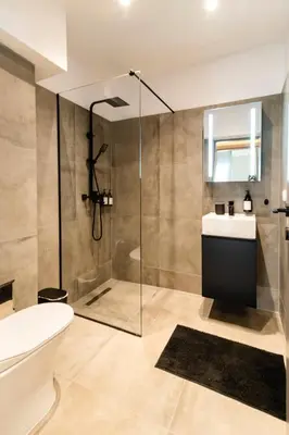 a bathroom with a shower and a toilet and a sink at Acropolis Gem in Rhodes Town