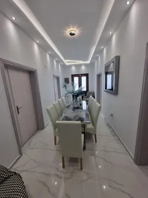a dining room with a table and chairs at City center beach house in Rhodes Town