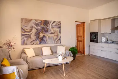 a living room with a couch and a table at Belvedere private luxury beach villa in Halki