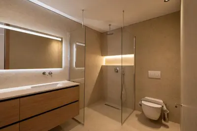 a bathroom with a shower and a toilet and a sink at Vista by Del Sol Villa in Rhodes Town