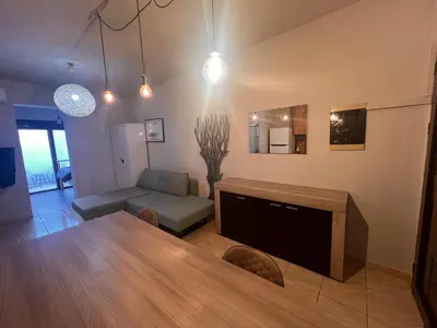 a living room with a table and a couch at Princeps De Cura Rhodes in Ialyssos