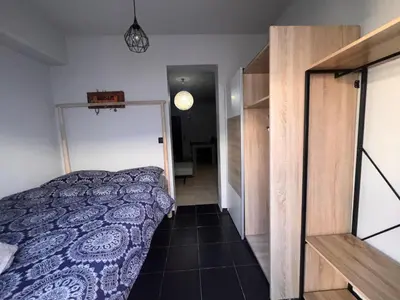 a bedroom with a bed and a door to a hallway at Princeps De Cura Rhodes in Ialyssos
