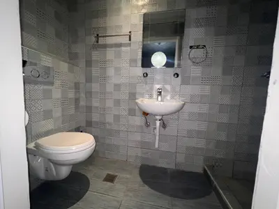 a bathroom with a toilet and a sink at Princeps De Cura Rhodes in Ialyssos