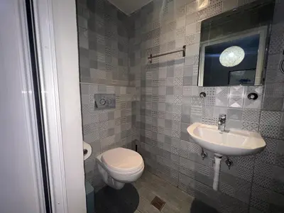 a bathroom with a toilet and a sink at Princeps De Cura Rhodes in Ialyssos