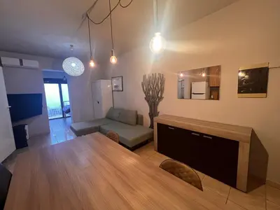 a living room with a table and a couch at Princeps De Cura Rhodes in Ialyssos