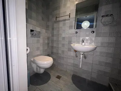 a bathroom with a toilet and a sink at Princeps De Cura Rhodes in Ialyssos