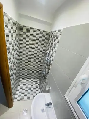 a bathroom with a sink and a toilet at Casa Evita in Gennadi