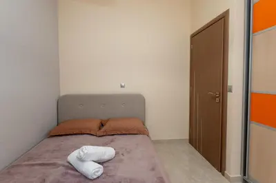 a bedroom with a bed with two towels on it at Mary Luxury House in Émbonas
