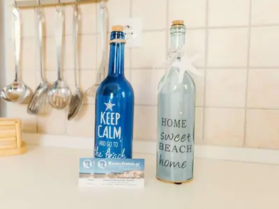 two bottles of water sitting on top of a kitchen counter at Holiday Home Gennadi Dreams Ferienvilla by Interhome in Gennadi