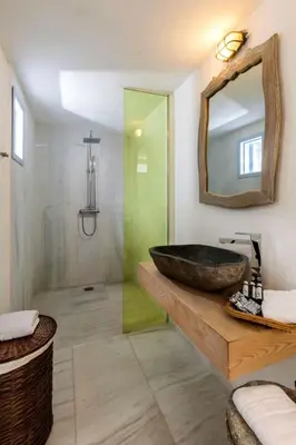 a bathroom with a large sink and a mirror at Holiday Home Amelie by Interhome in Triánta