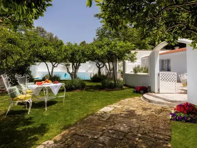 a patio with a table and chairs in a yard at Holiday Home Amelie by Interhome in Triánta