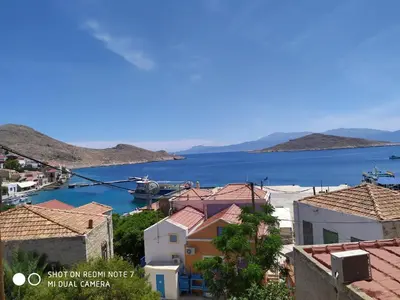 a view of a town and a body of water at Villa Chrysodimi in Halki