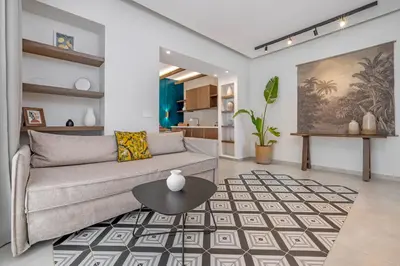 a living room with a couch and a table at Avaton Boutique Suites in Vrachonisída touArchangélou