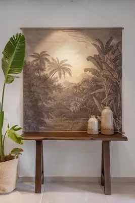 a tapestry hanging on a wall with two vases on a table at Avaton Boutique Suites in Vrachonisída touArchangélou