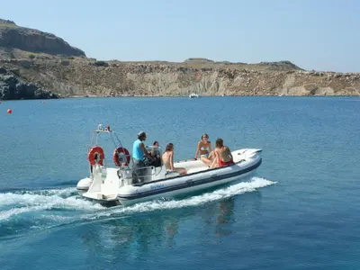 a group of people on a boat in the water at Holiday Home Haus in Kolympia mit Parkplatz und Bergblick by Interhome in Kolimbia