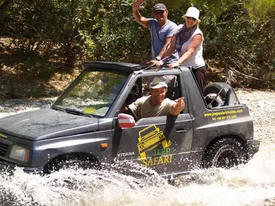 a group of people in a jeep in the water at Holiday Home Haus in Kolympia mit Parkplatz und Bergblick by Interhome in Kolimbia
