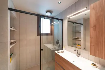 a bathroom with a shower and a sink and a mirror at Estate Irianna 4 Bedroom Private Pool Villa & 2 Bedroom Guesthouse Rhodes in Ialyssos