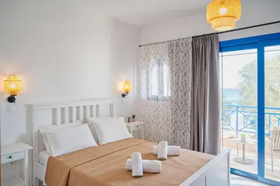 a bedroom with a bed with two towels on it at Anna's view Stegna in Vrachonisída touArchangélou