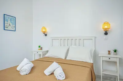 a bedroom with a bed with two towels on it at Anna's view Stegna in Vrachonisída touArchangélou
