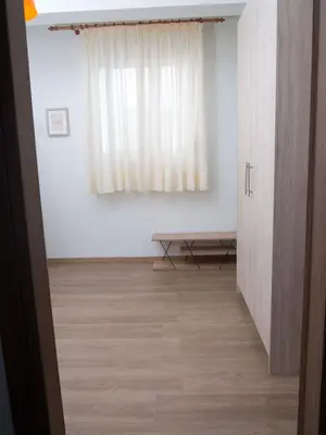 a room with a window and a wooden floor at My Home in Ialyssos in Ialyssos