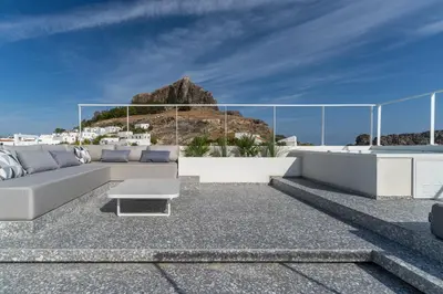 a living room with a couch and a table at Lindos 4 me Villa in Líndos