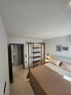 a bedroom with a bed and a ladder in it at Casa Bronx luxury apartment in Rhodes Town