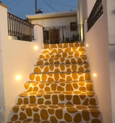 a set of stairs with orange food on them at Villa Savastoula in Phanaes