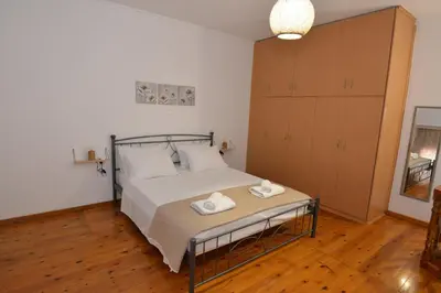 a bedroom with a bed with two towels on it at Sotirias House in Rhodes Town