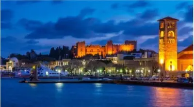 a city with a clock tower and a large building at Sotirias House in Rhodes Town