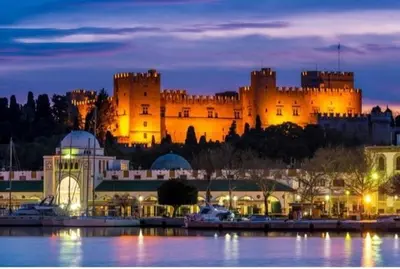 a castle is lit up at night at Sotirias House in Rhodes Town