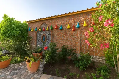 a small brick house with colorful easter eggs on it at Rhodes Archaggelos Nests - Fully Equipped Getaways in Archangelos