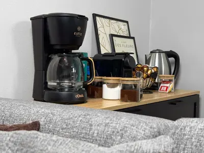 a counter with a coffee maker on a table at Kálos Housing - Adults Only in Kolimbia