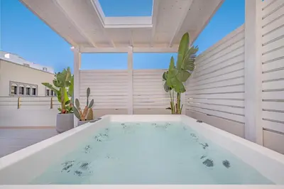 a bath tub in the middle of a room with at Rhodes center Santa Marina in Rhodes Town