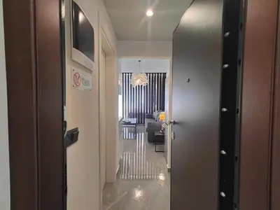 a hallway with a door leading to a living room at Rhodes City Haven in Rhodes Town