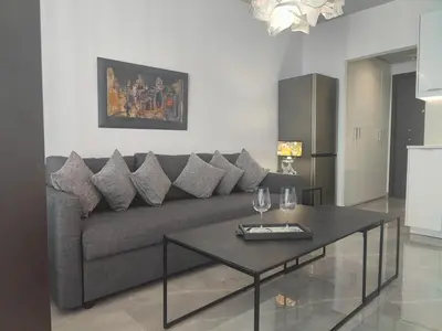 a living room with a couch and a table at Rhodes City Haven in Rhodes Town