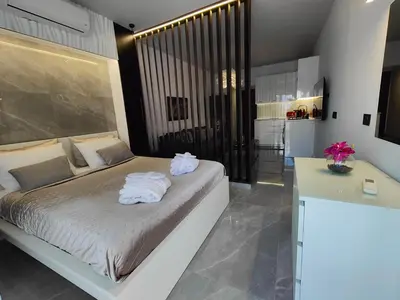 a bedroom with a bed with towels on it at Rhodes City Haven in Rhodes Town