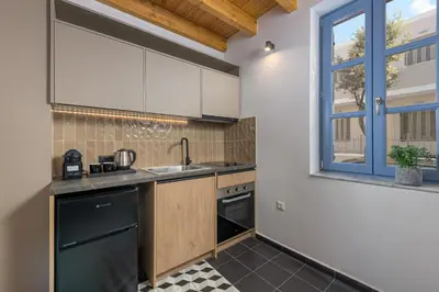a kitchen with a sink and a window at Villa fiore in Rhodes Town