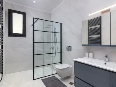 a bathroom with a shower and a toilet and a sink at Holiday Home Villa Galini by Interhome in Haraki