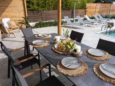 a black table with a bowl of fruit on it at Holiday Home Haus in Afantou - Privater Parkplatz und Pool by Interhome in Afantou