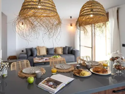 a living room with a table with plates of food at Holiday Home Haus in Afantou - Privater Parkplatz und Pool by Interhome in Afantou