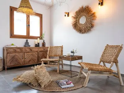 a room with two chairs and a table and a mirror at Holiday Home Haus in Afantou - Privater Parkplatz und Pool by Interhome in Afantou
