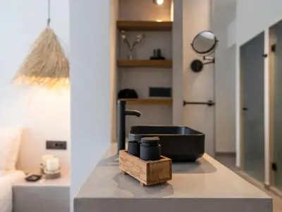a kitchen with a counter with a sink and a table at Holiday Home Haus in Afantou - Privater Parkplatz und Pool by Interhome in Afantou