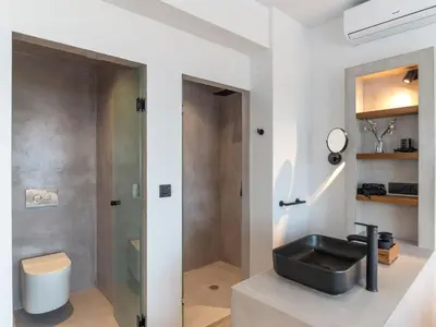 a bathroom with a black sink and a shower at Holiday Home Haus in Afantou - Privater Parkplatz und Pool by Interhome in Afantou