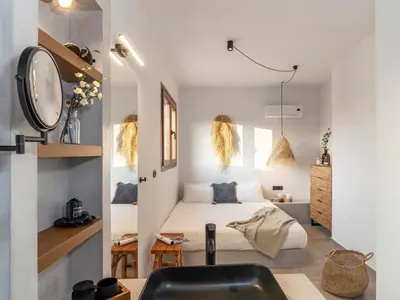 a bedroom with a bed and a sink in a room at Holiday Home Haus in Afantou - Privater Parkplatz und Pool by Interhome in Afantou