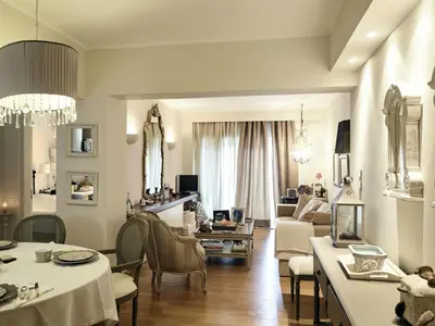 a living room with tables and chairs and a couch at Apartment Einzigartige Wohnung auf Rhodos by Interhome in Rhodes Town