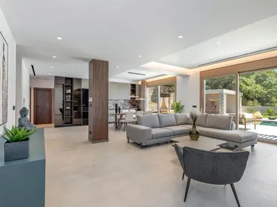 a living room with a couch and a table at Holiday Home Emerald Estate by Interhome in Asgourou