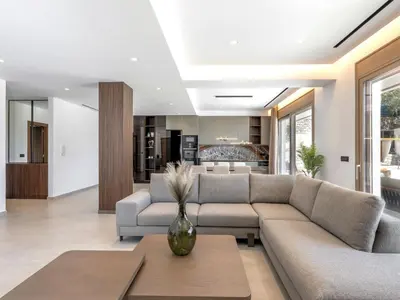 a living room with a couch and a table at Holiday Home Emerald Estate by Interhome in Asgourou